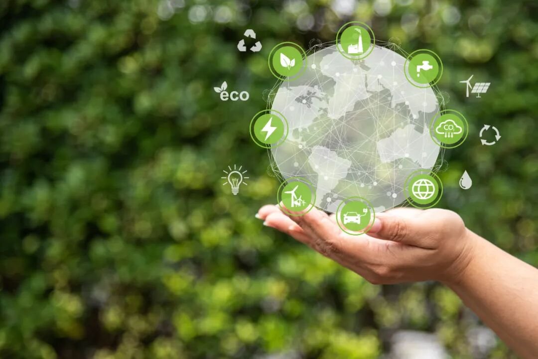 Digital globe with icons representing clean energy and sustainability